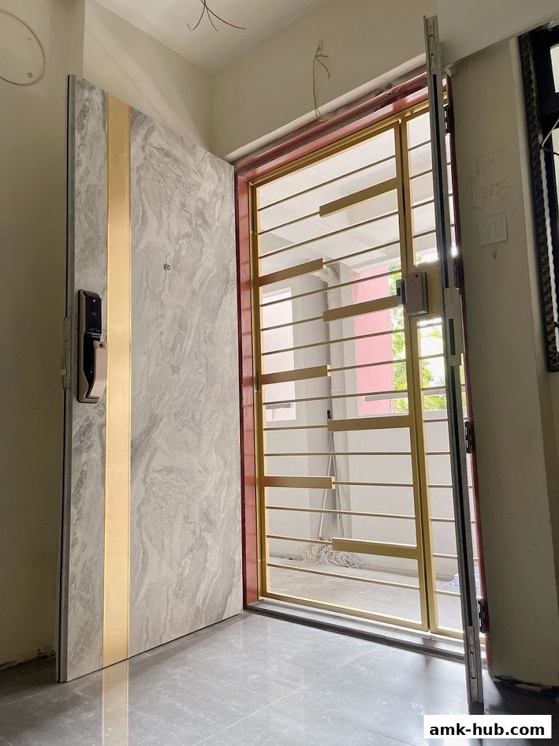 A modern digital lock installed on a marble-patterned door with a gold accent.