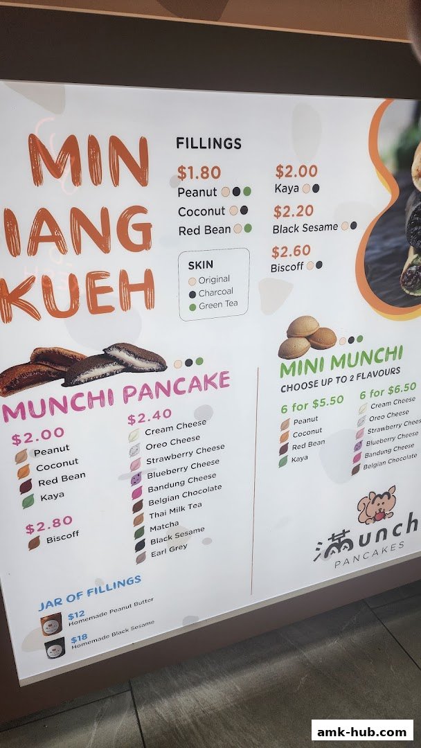 A menu board for Munchi Pancakes, showcasing various fillings and pancake options.