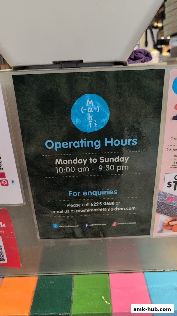 A sign displaying Maki-San's operating hours and contact information.