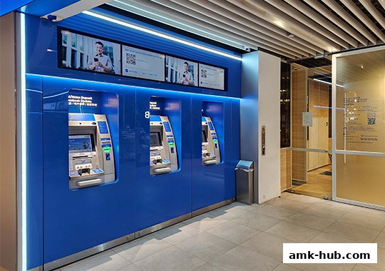 UOB Bank's modern ATM area with multiple machines and digital displays.