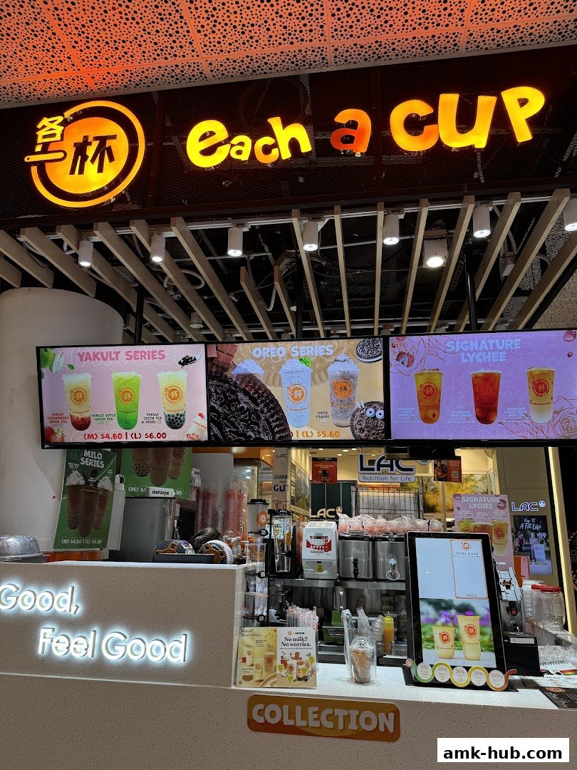 The Each a Cup shop front displays its menu with various drink series and prices.