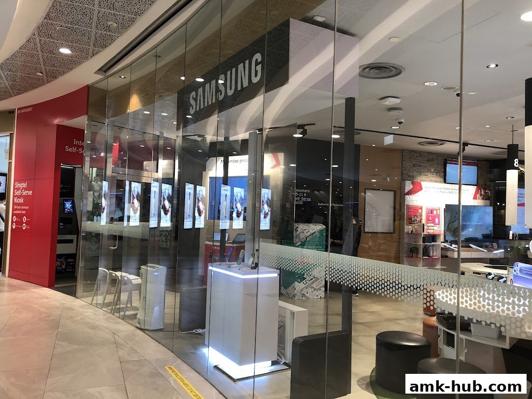 The exterior of a Singtel and Samsung shop with a self-serve kiosk.