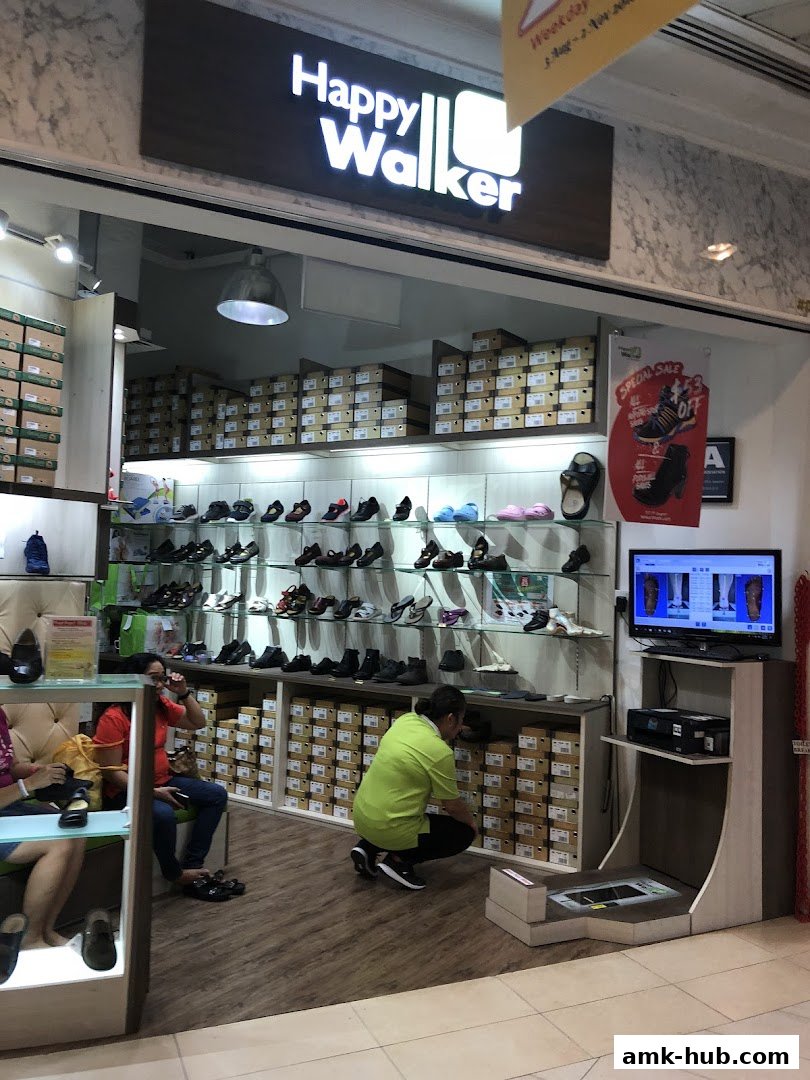 Interior view of Happy Walker shoe store with shoes displayed and boxes stacked.