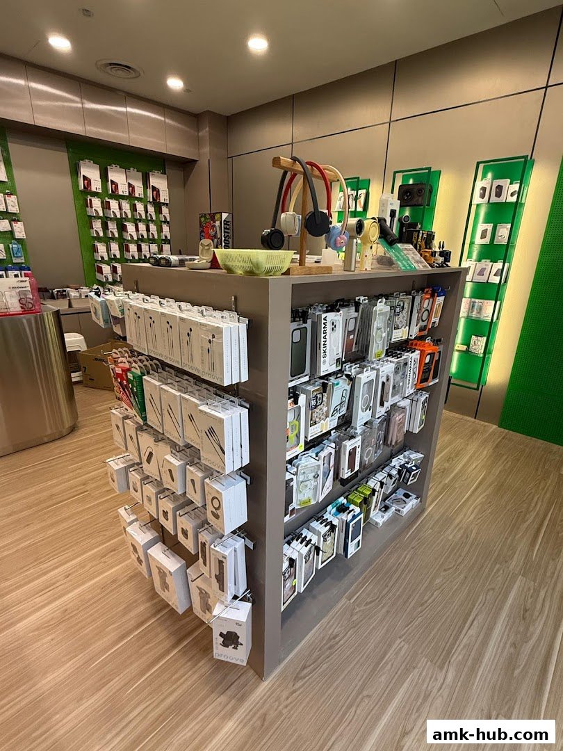 A retail shop displaying a variety of mobile accessories, including headphones and phone cases.