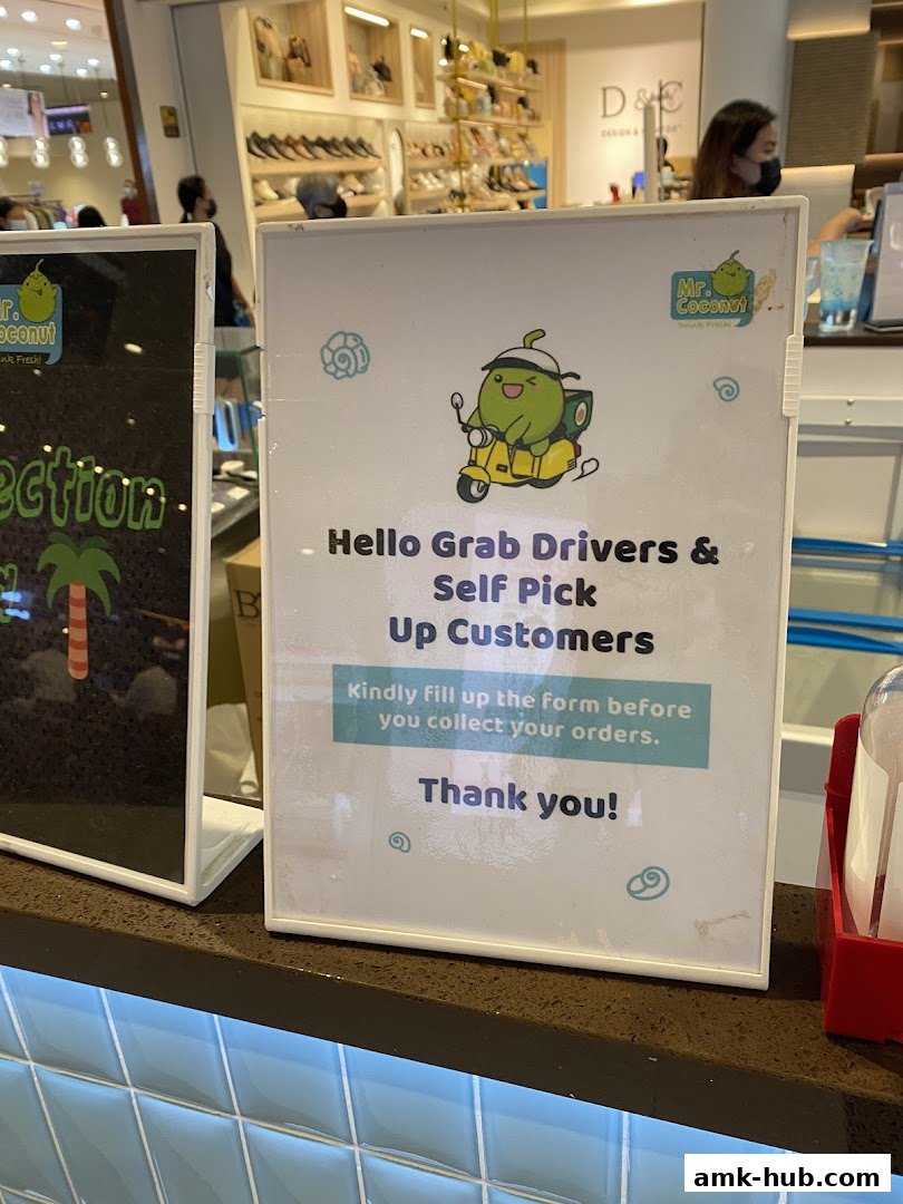 A sign at Mr. Coconut informs Grab drivers and self-pickup customers to fill out a form.