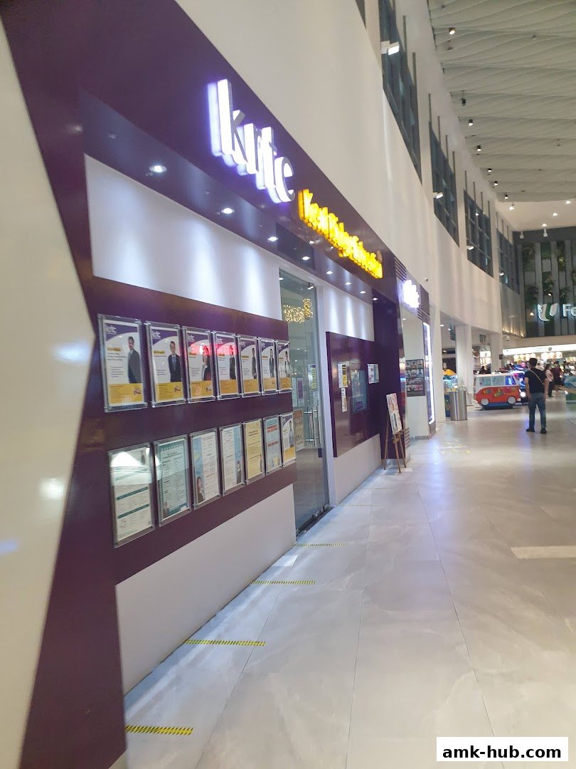 The exterior of the KRTC Ang Mo Kio shop, showcasing its prominent signage and framed certificates.