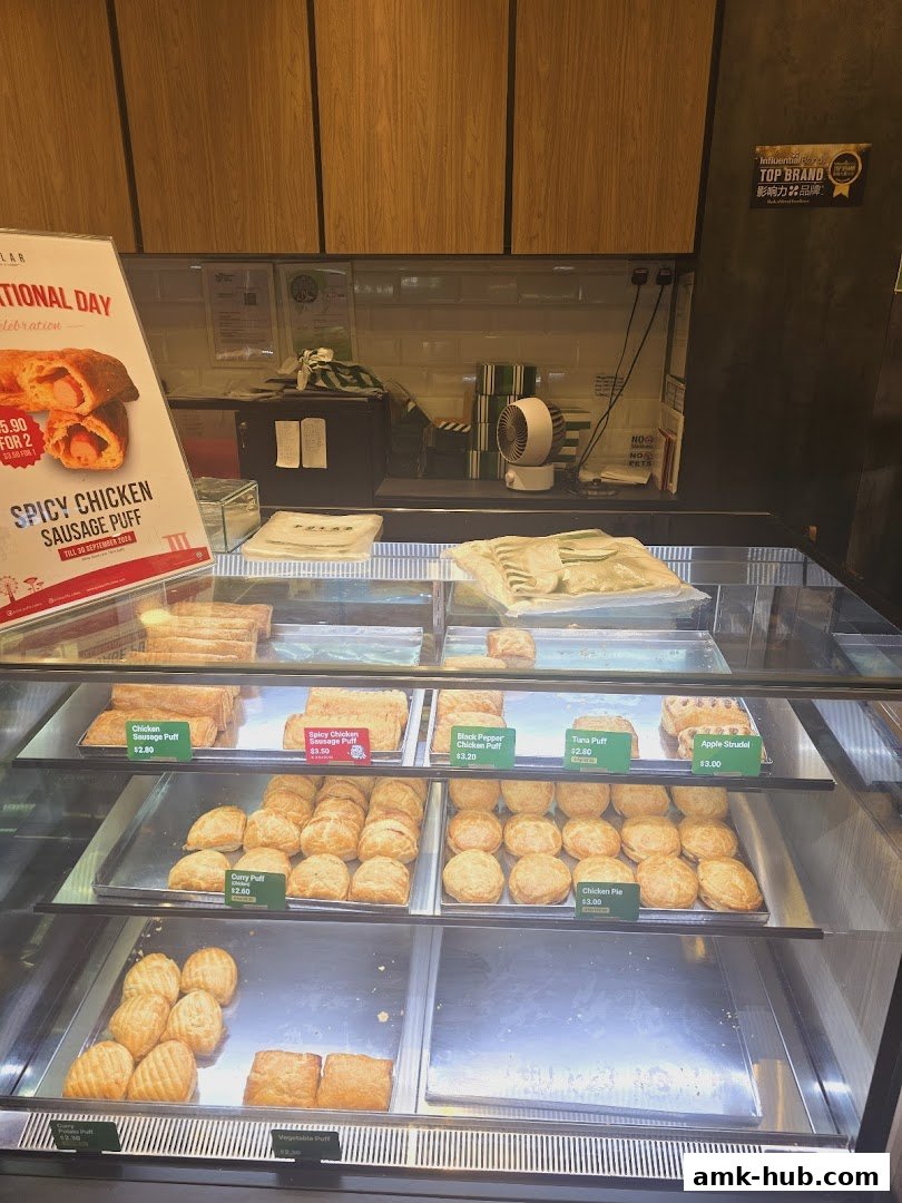 A display case filled with various freshly baked puffs and pastries at Polar Puffs.