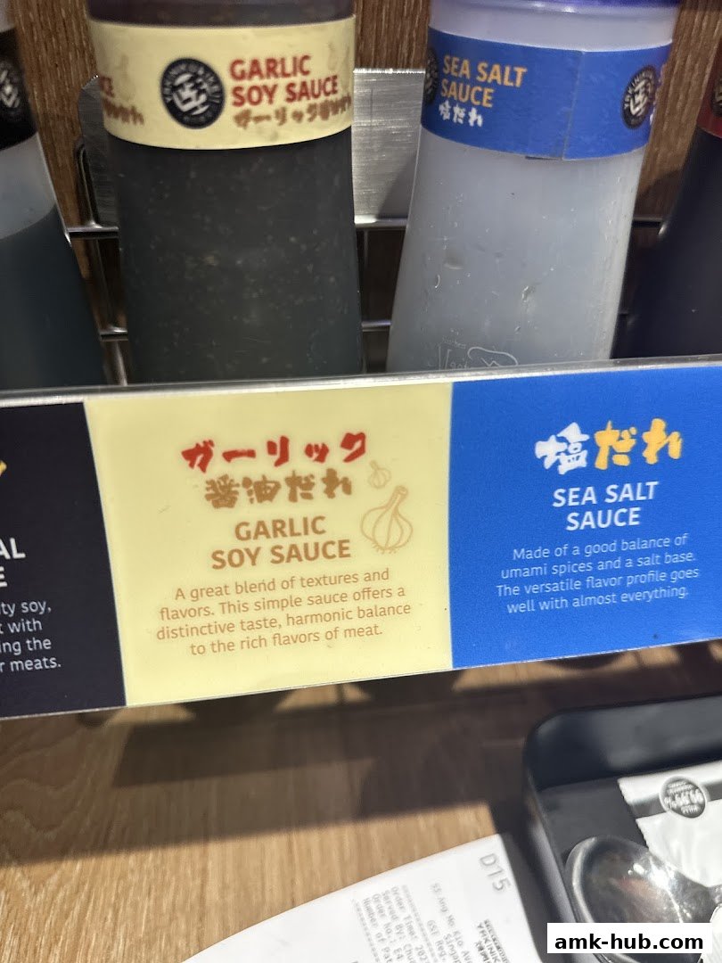 Close-up of Garlic Soy Sauce and Sea Salt Sauce bottles with descriptive labels.