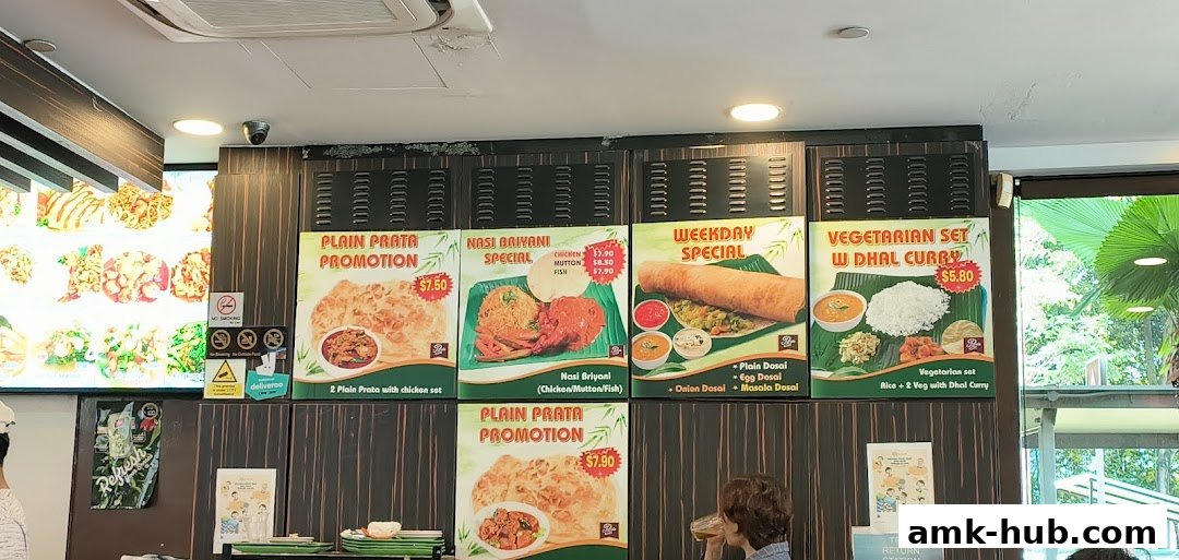 A menu board displaying various Indian food promotions and specials at Prata Raya.