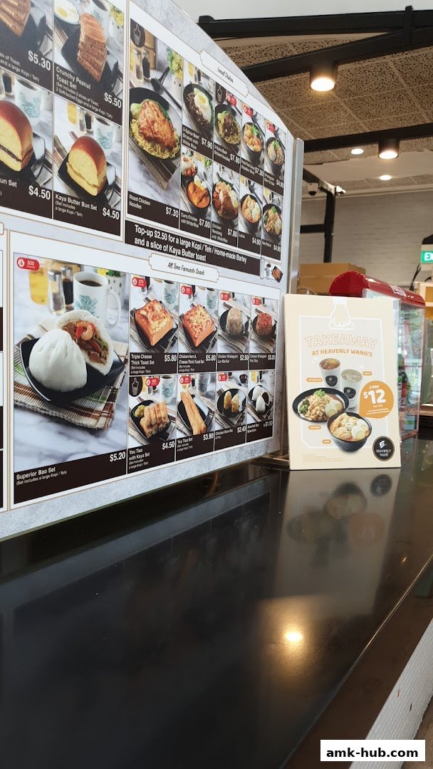 A menu board displaying various food items and sets from Heavenly Wang.