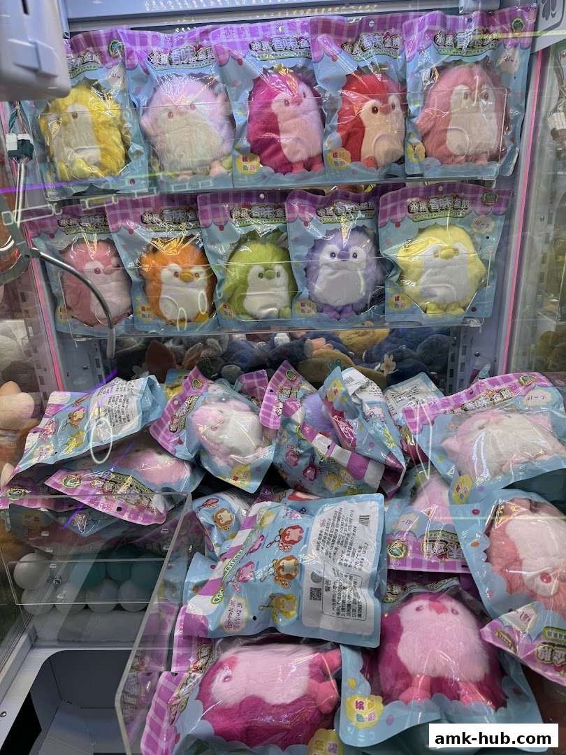 A claw machine filled with colorful, fluffy plush toys in packaging.
