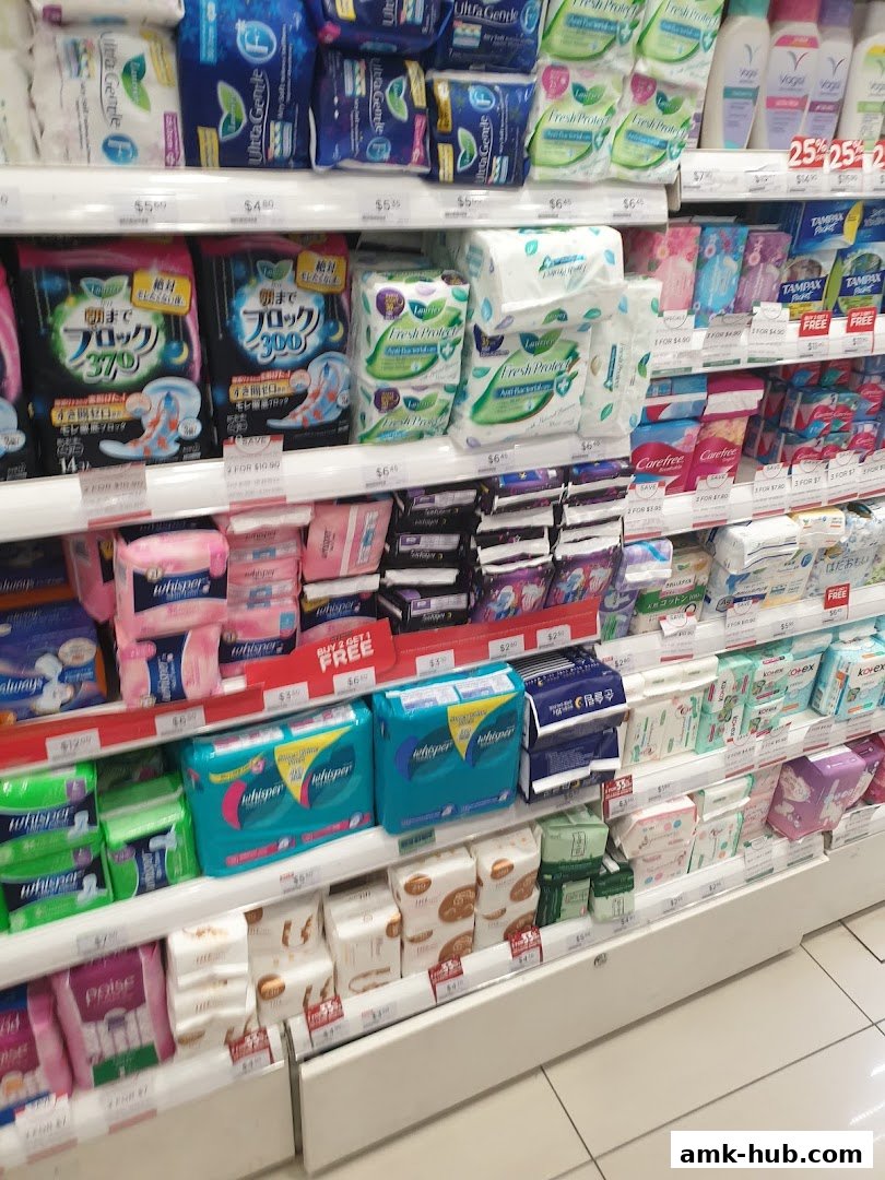 Shelves stocked with various sanitary pads and feminine hygiene products.