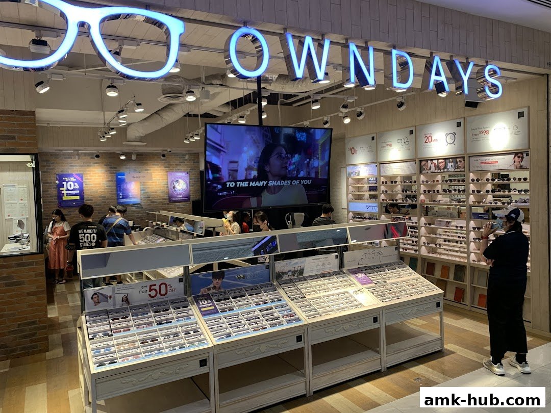 Interior of an eyeglasses store with displays of glasses and promotional signage.