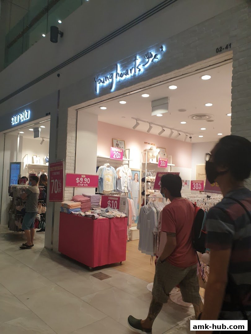 The storefront of Young Hearts, a lingerie and apparel shop, with promotional signage.