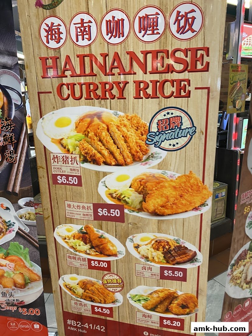 A menu board displays various Hainanese curry rice dishes with prices.