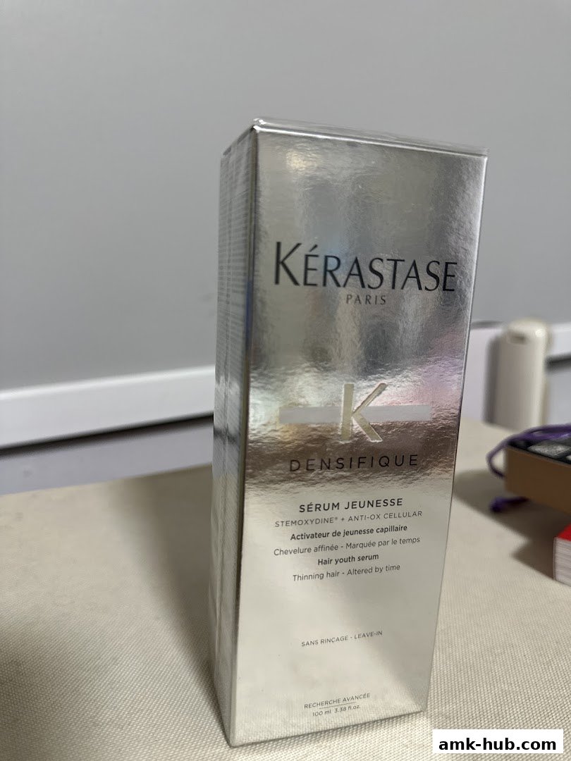 A silver box of Kérastase Densifique Sérum Jeunesse hair serum.