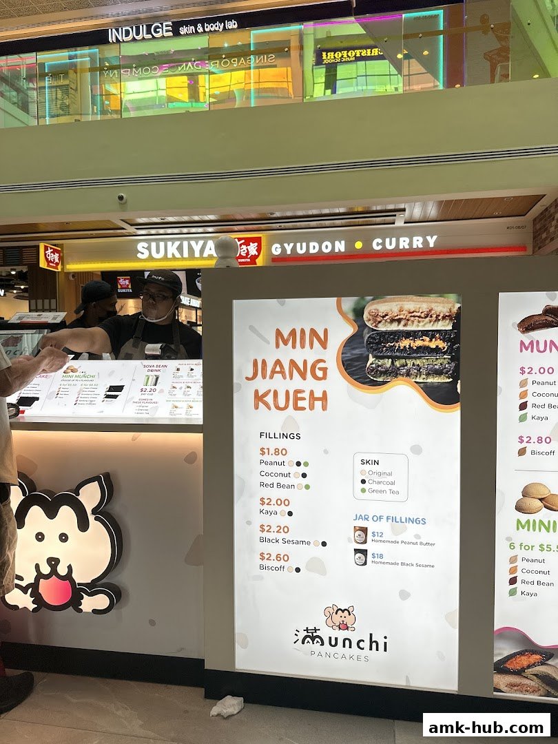 A menu board for Munchi Pancakes displaying various fillings and skin options for Min Jiang Kueh.