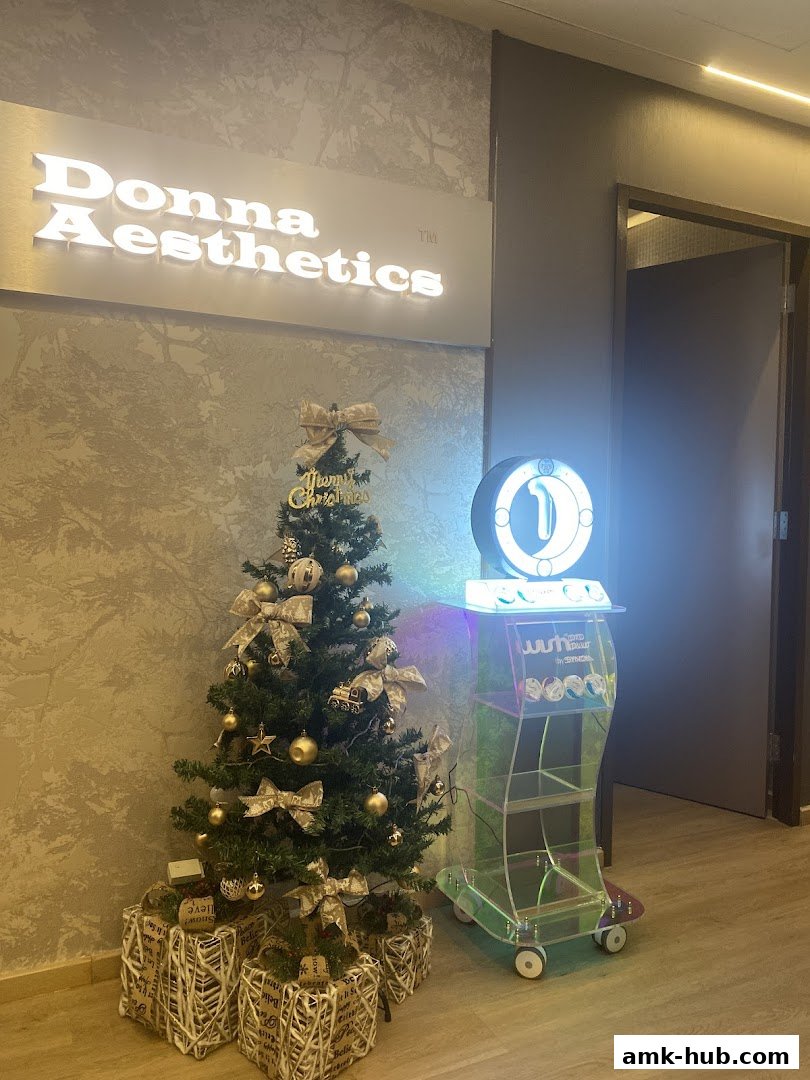 A festive Christmas tree and display stand outside Donna Aesthetics.