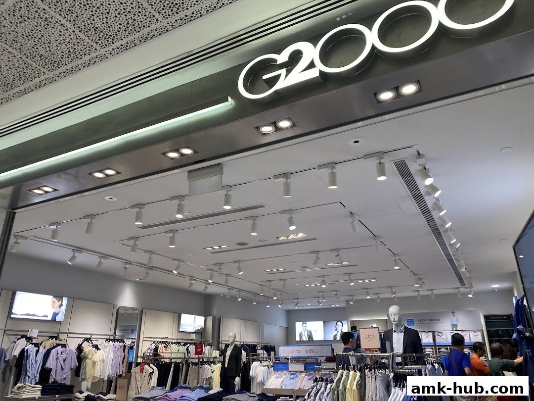 Interior view of a G2000 clothing store with racks of apparel and mannequins.