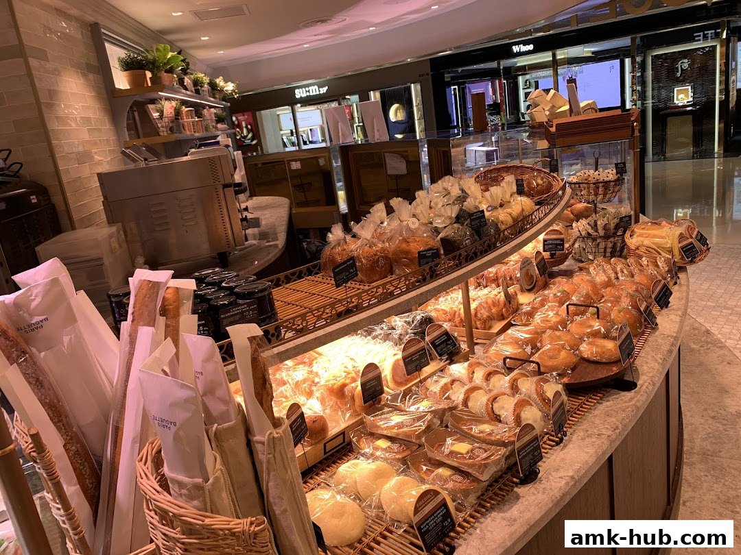 A display of freshly baked bread and pastries at Paris Baguette.