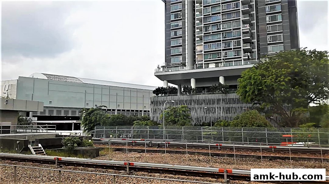 Exterior view of a UOB bank branch and a modern residential building.