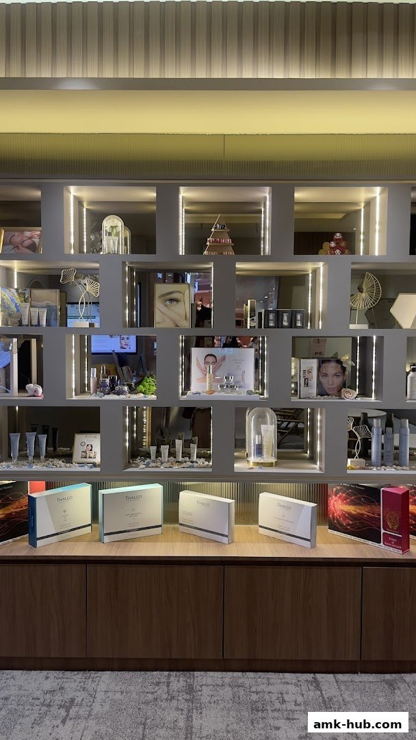 Shelves displaying various beauty products and skincare sets, illuminated by soft lighting.