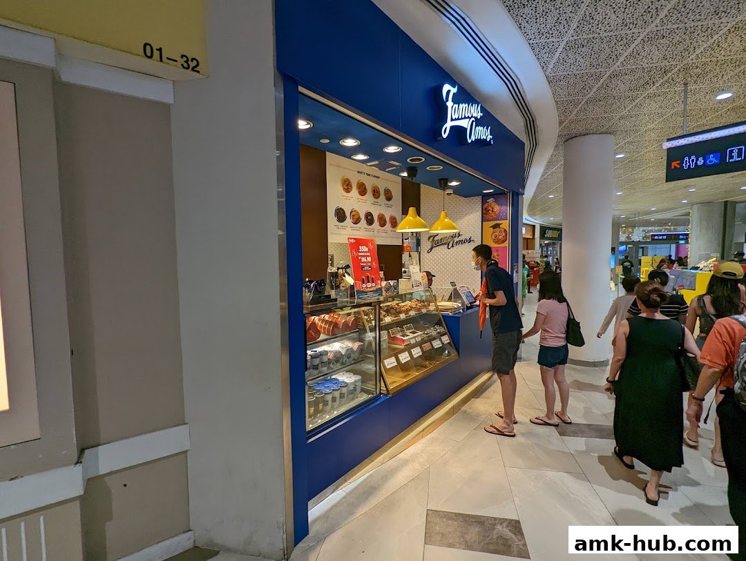 Famous Amos cookie shop with customers ordering and browsing treats.