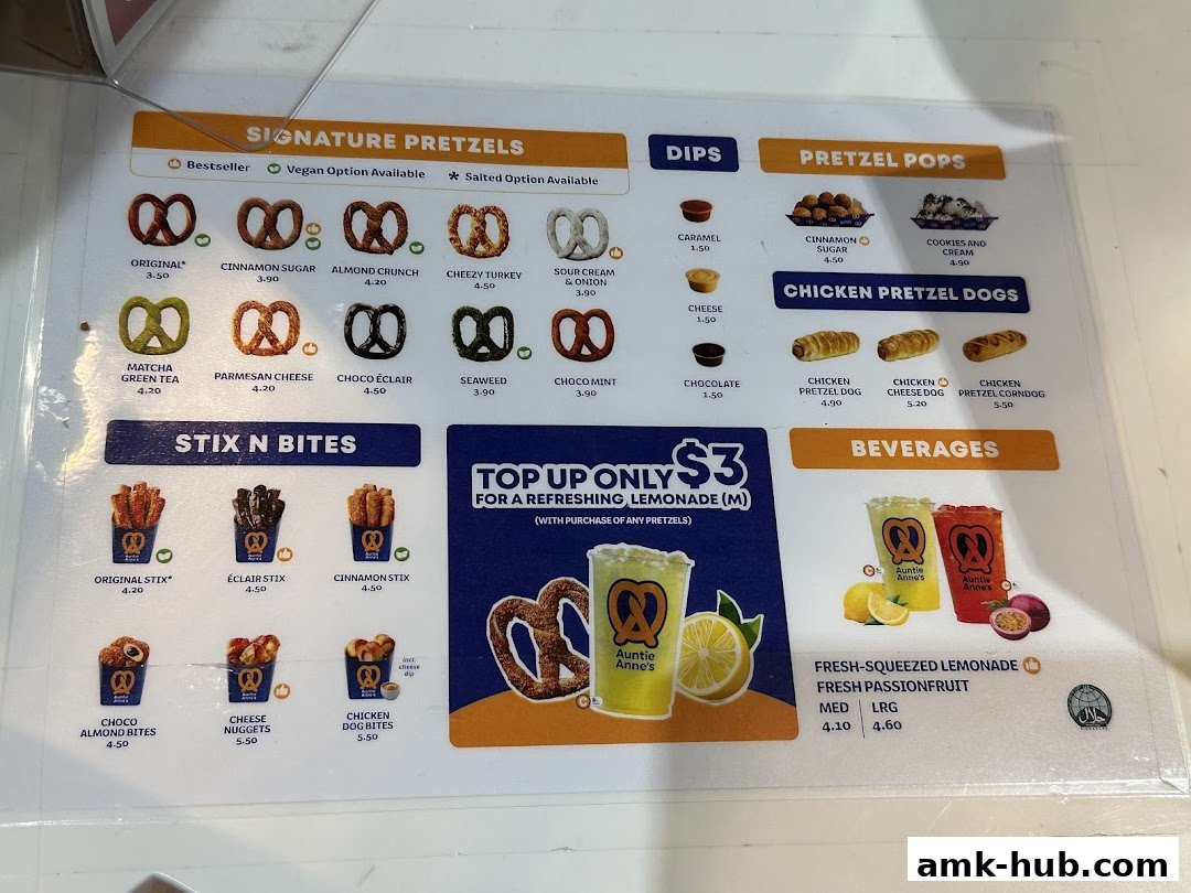 A menu from Auntie Anne's featuring signature pretzels, dips, pretzel pops, stix n bites, and beverages.
