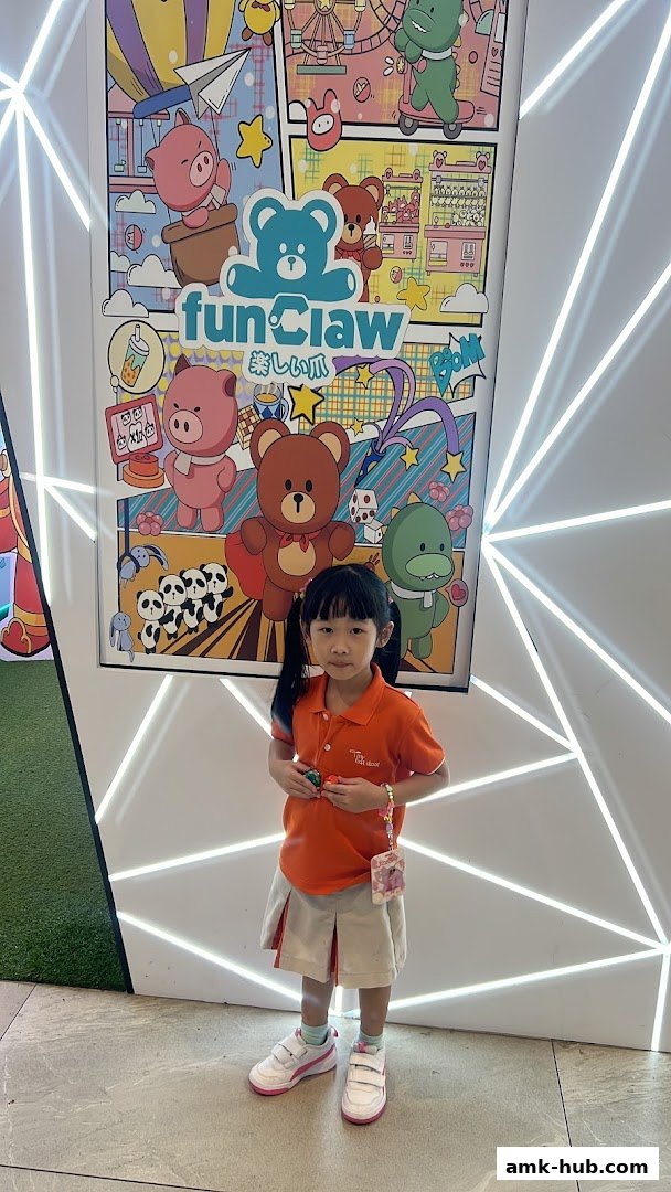 A young girl stands in front of a colorful mural featuring cartoon animals and the shop name "Fun Claw".