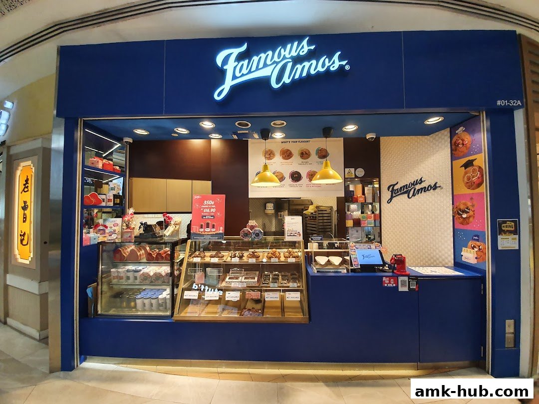 The Famous Amos shop front displays a variety of cookies and treats in display cases.