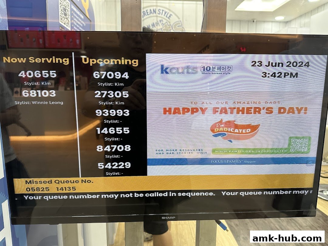 A screen displaying queue numbers, stylist names, and a Father's Day message.