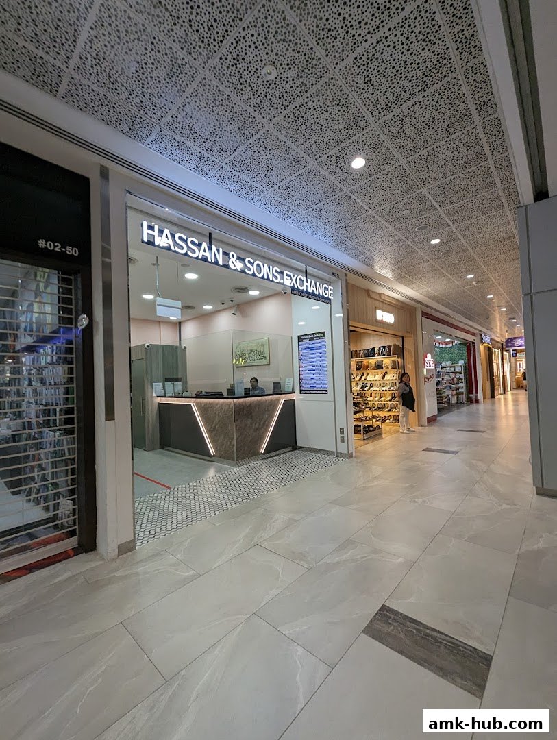 The exterior of Hassan & Sons Exchange, a currency exchange shop in a mall.