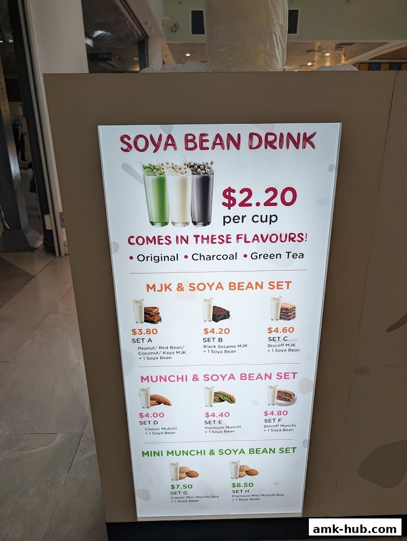 A menu board for Munchi Pancakes, showcasing soya bean drinks and various sets.