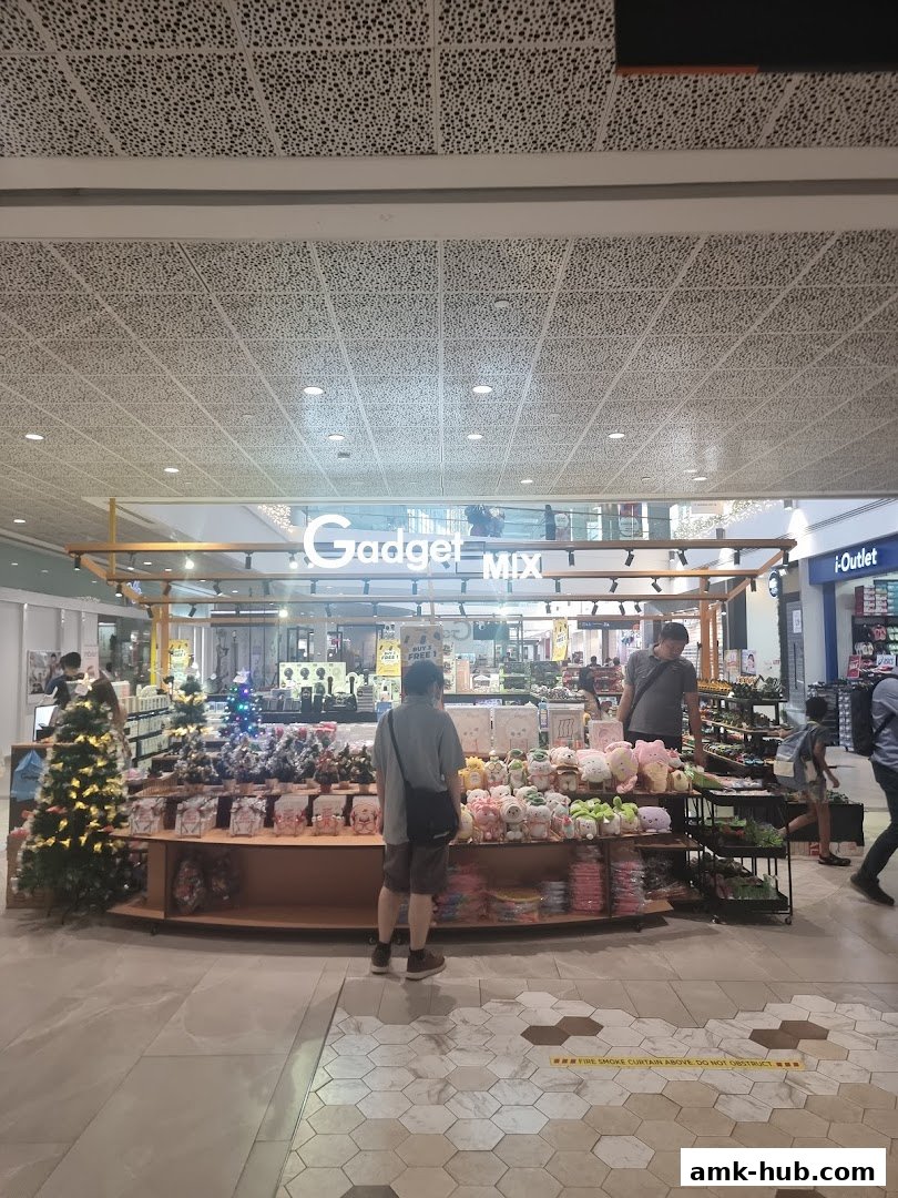 A retail shop called Gadget MIX displays various items including plush toys and decorative items.