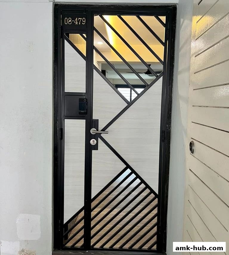 A modern black metal gate with a geometric design and a digital lock.