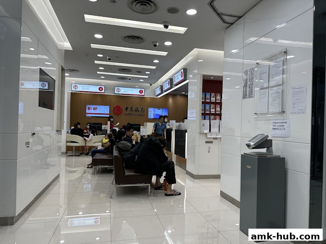 Interior of a Bank of China branch with customers waiting and staff at counters.