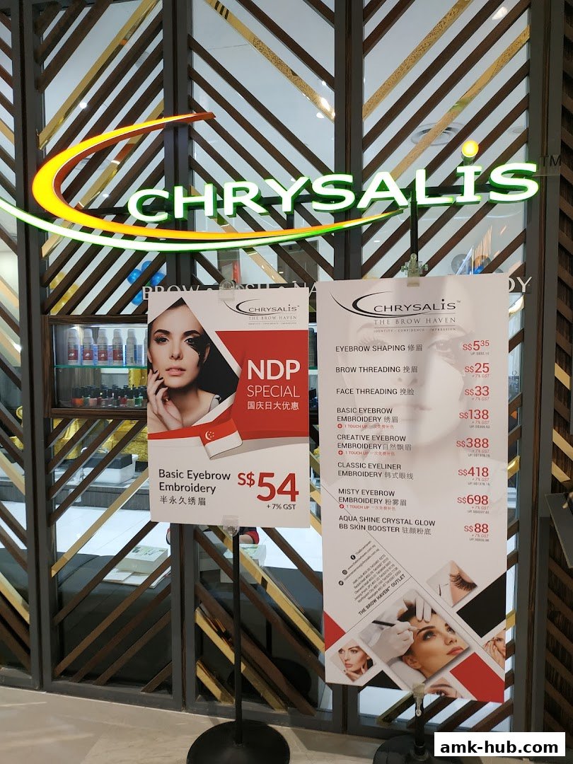 Chrysalis Spa shop front with promotional posters for eyebrow services.