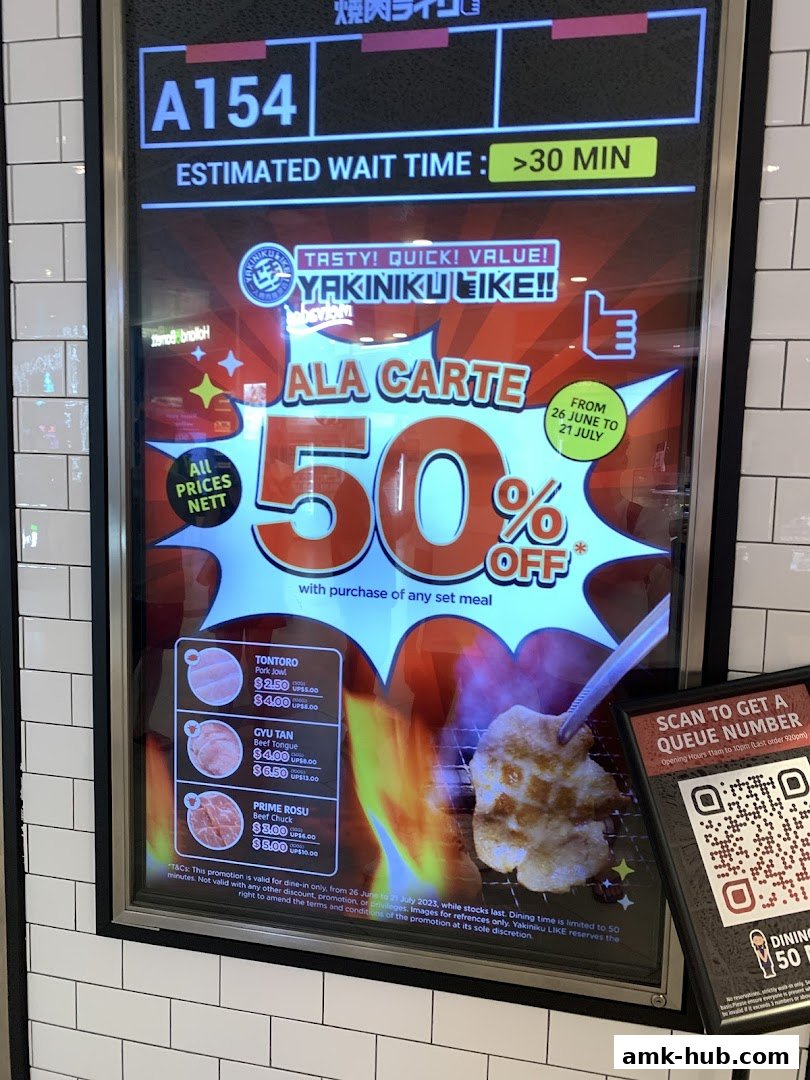 A digital display shows a 50% off promotion for Yakiniku Like with estimated wait time.