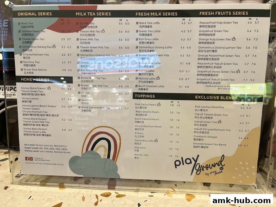A menu board displaying various milk teas, fruit teas, and toppings with prices.