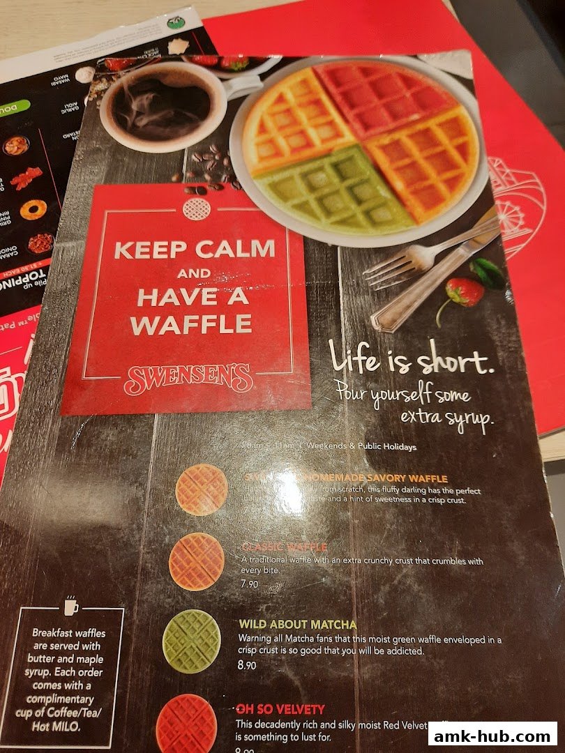 A menu featuring various waffles with descriptions and prices, including a colorful waffle.