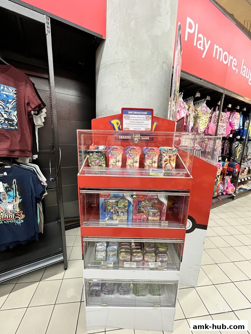 A display stand filled with Pokemon trading cards and related merchandise.