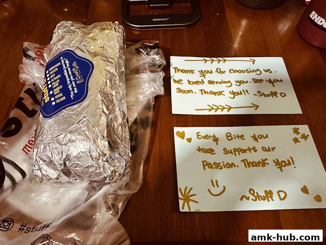 A foil-wrapped burrito and thank you notes from Stuffd More.