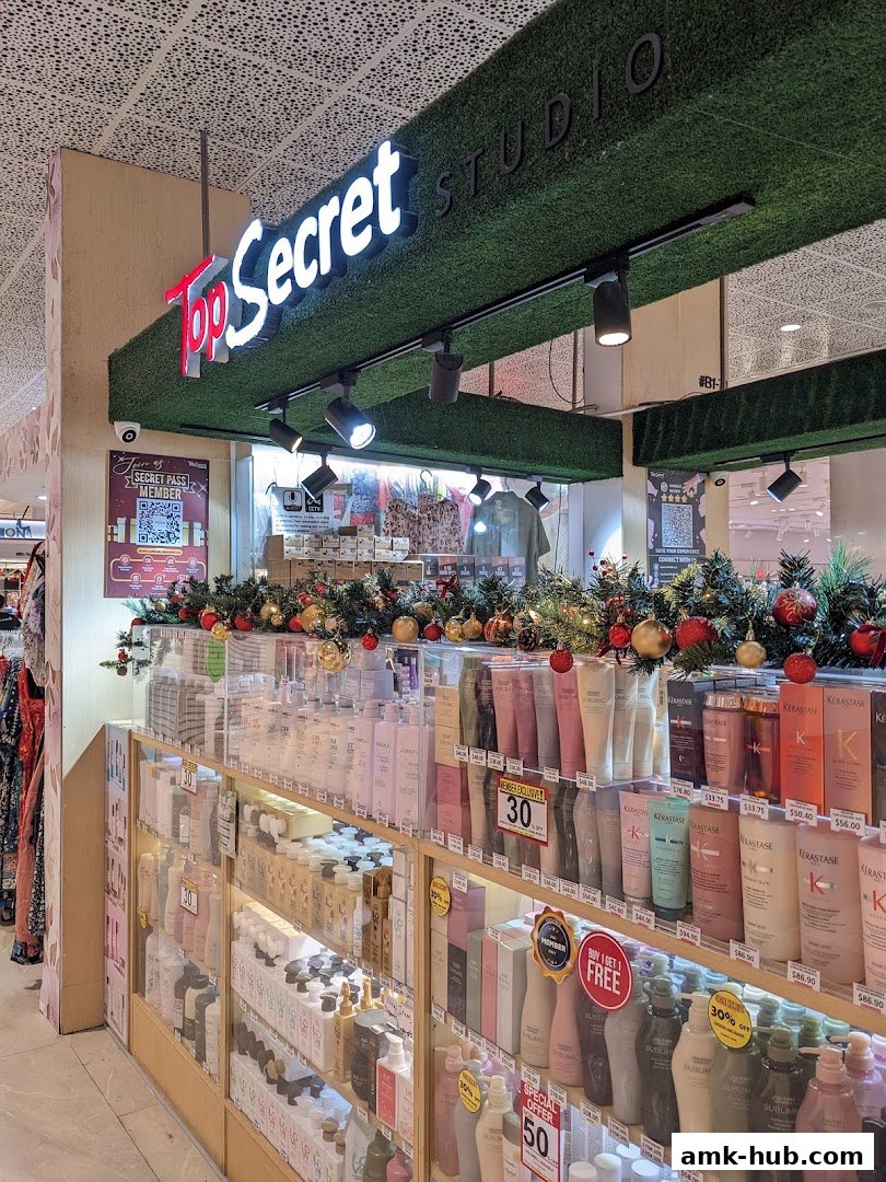 The storefront of Top Secret Studio, showcasing a wide array of beauty products and holiday decorations.