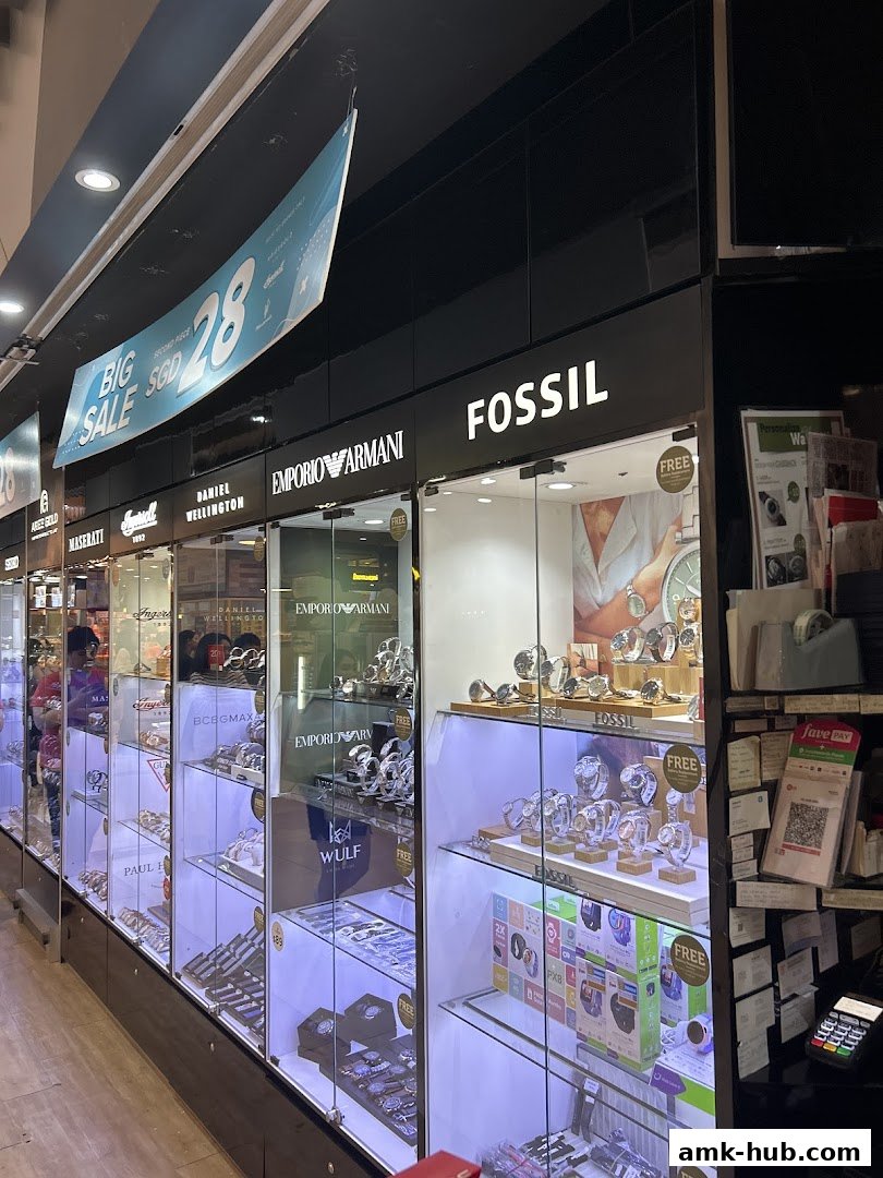 A shop front displaying various watch brands like Fossil and Emporio Armani with a 'Big Sale' banner.