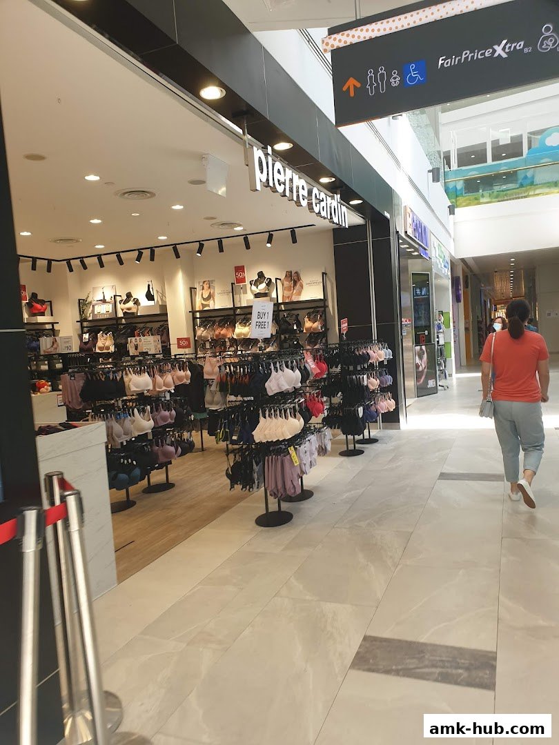 The Pierre Cardin Lingerie shop displays a wide selection of bras and lingerie on racks.