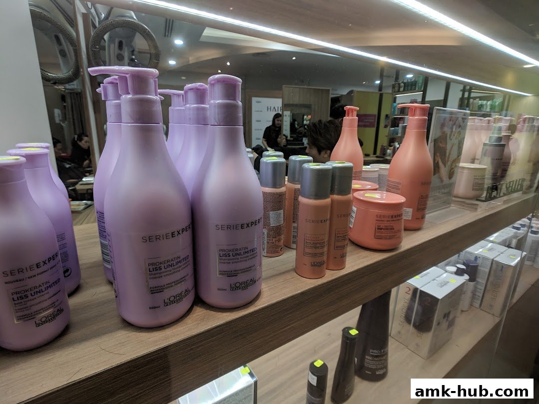 A display of L'Oréal Serie Expert hair care products, including shampoos and treatments.