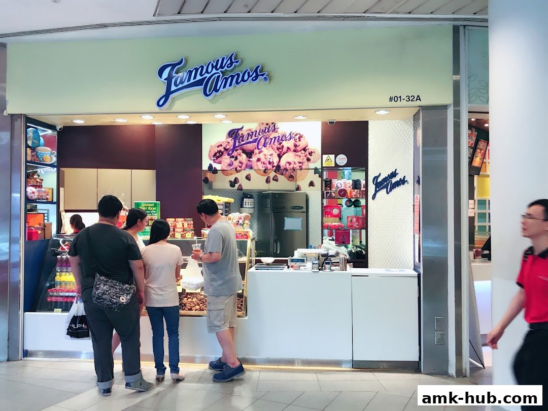 Customers are queuing at the Famous Amos cookie shop counter.