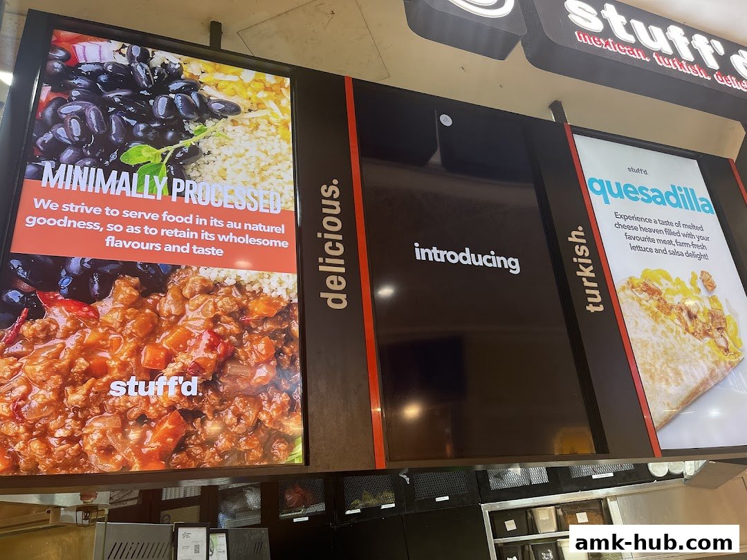 A food shop's display featuring minimally processed food and a quesadilla.