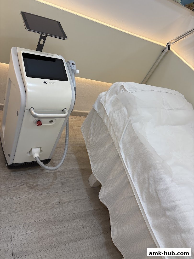 A beauty treatment bed and a 4D LIGHT machine in a clean, modern salon.