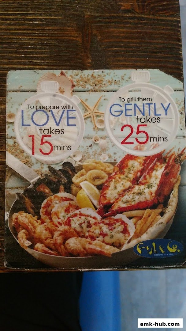 A menu featuring a seafood platter with lobster, shrimp, mussels, and calamari.